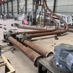 Horizontal pipe chain conveyor tube bends and support assembly