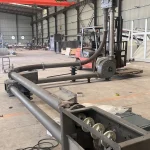Pipe chain conveyor showing chain-mounted conveying discs